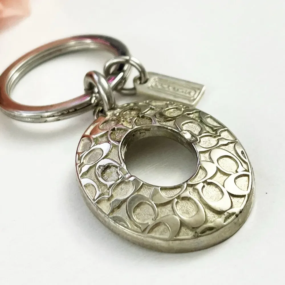 Coach Silver Tone Oval Signature C Keychain
